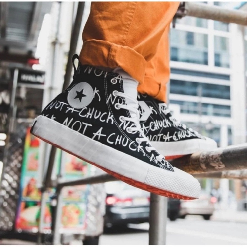 Converse Black and White High-Tops with Orange Accents